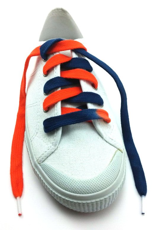 a white shoe with a shoelace that is navy blue on the right and orange on the left