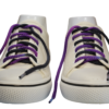 a pair of white sneakers with braided shoelaces which are purple on one side and black on the other