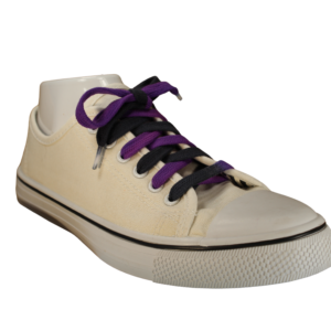 Black and purple shoelaces in a white shoe