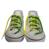 a pair of braided shoelaces with green on one half of the shoelace, yellow on the other