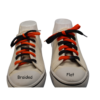 a pair of black and orange shoelaces comparing the braided vs the flat