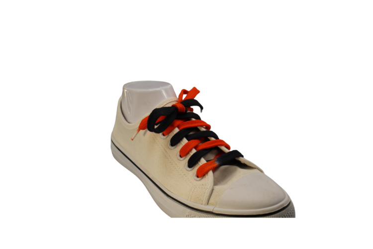 Black and orange bi-colored shoelaces at an angle