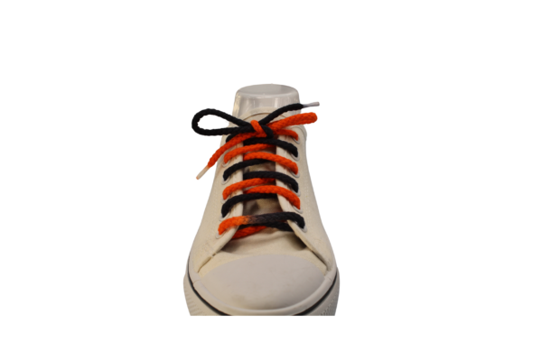 black and orange braided shoelace tied