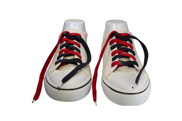 a pair of white shoelaces with flat custom dyed red and black shoelaces