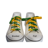 a pair of green and gold shoelaces in a white shoe comparing the flat vs braided shoestring