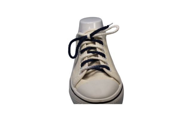 navy blue and white braided shoelace on a white shoe