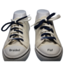 comparison of a braided shoelace and a flat shoelace colored navy blue and white