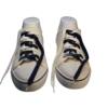 a pair of white sneakers with flat untied navy blue and white shoelaces