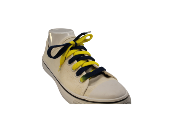 Navy Blue and Yellow shoelaces at an angle in a white tennis shoe