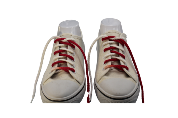 a pair of red and white braided shoelaces