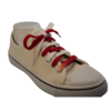 Red and white flat shoelaces in a shoe at an angle